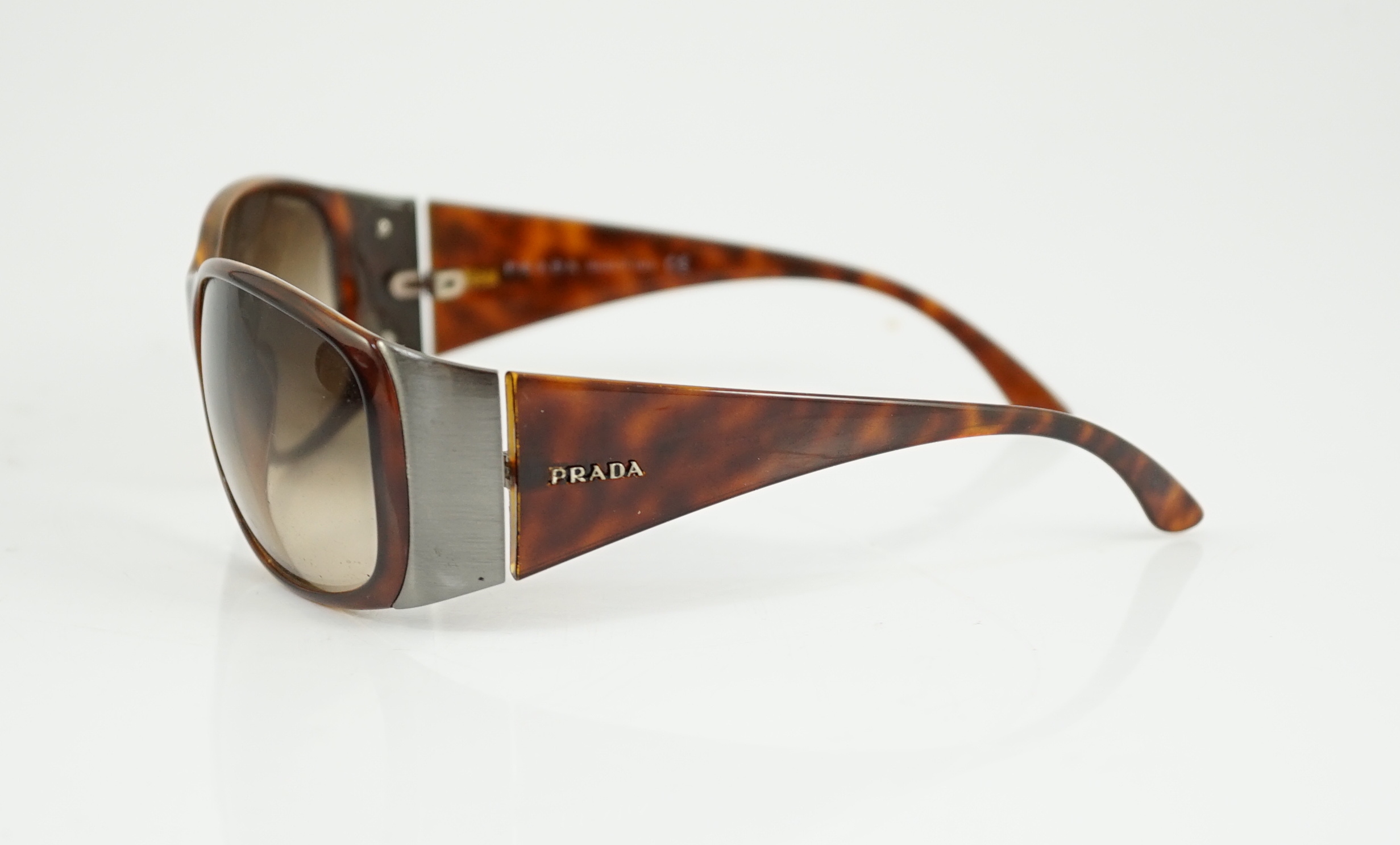 A pair of Prada tortoiseshell sunglasses